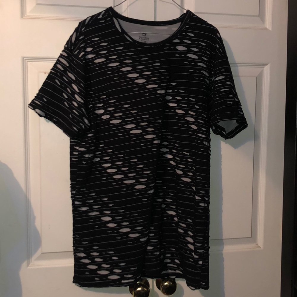 A ripped black and white shirt.